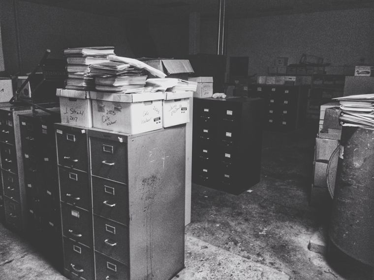 Folders kept in a filing cabinet