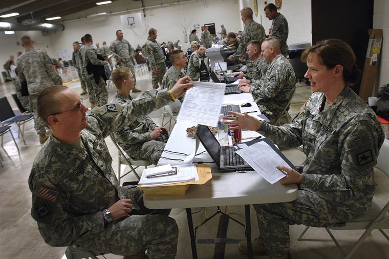 Public service members reviewing paperwork